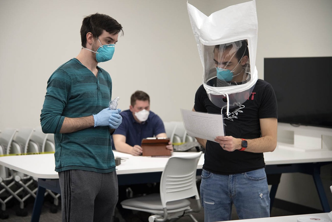 First-year College of Medicine – Tucson student Billy Evans observes second-year student Alexandre Cavalcante reading a passage as part of the fitting exercises.