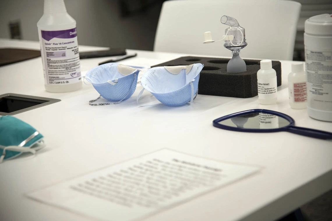 Items on a table used for N95 mask fitting.