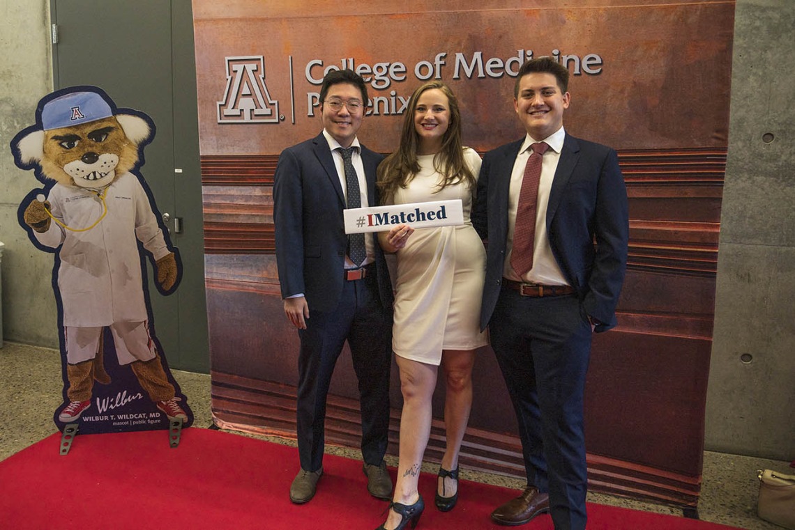 University of Arizona College of Medicine – Phoenix students (from left) Robert Yang, Michelle Peterson and Joseph Neely pose for a photo together before the start of UArizona College of Medicine – Phoenix Match Day 2022 event.