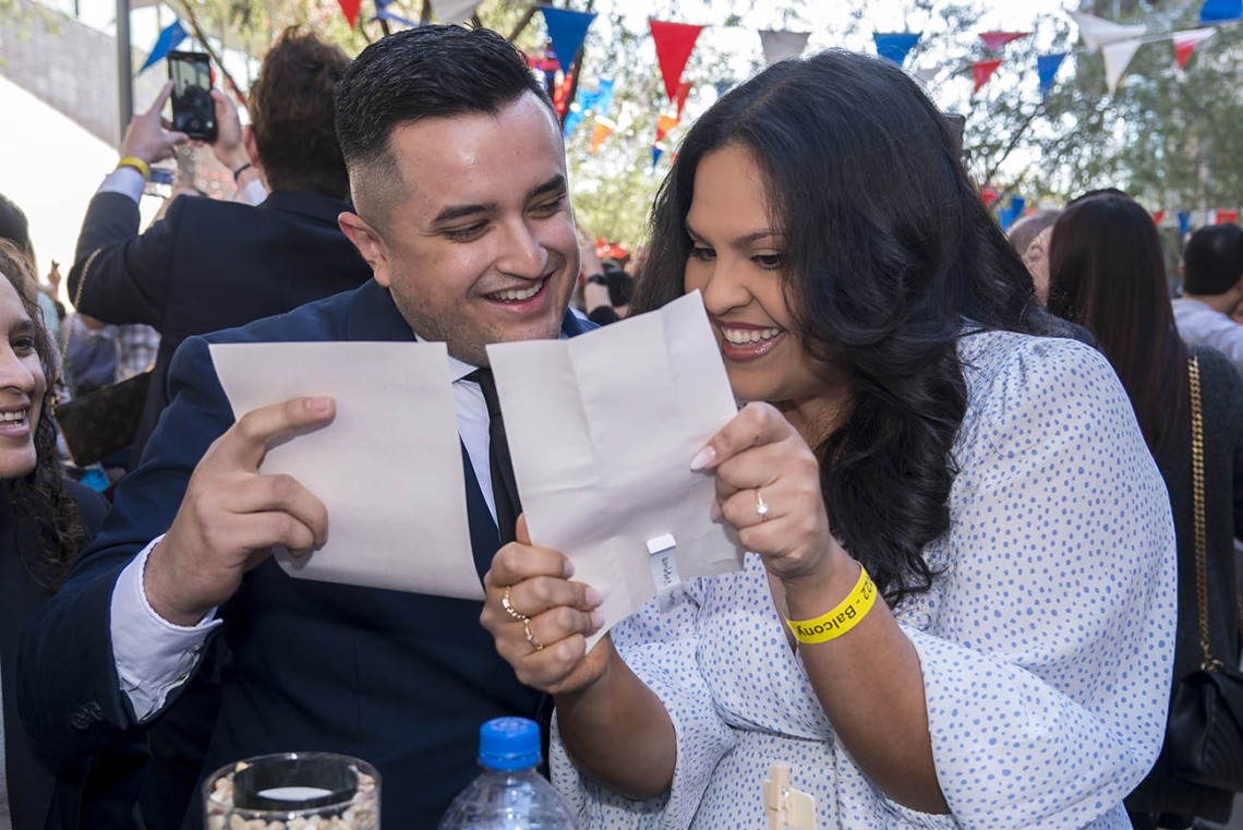 Jesus Sandoval and Valeria Vasquez read their match letters to see where they were matched during the College of Medicine – Phoenix Match Day 2022 event.