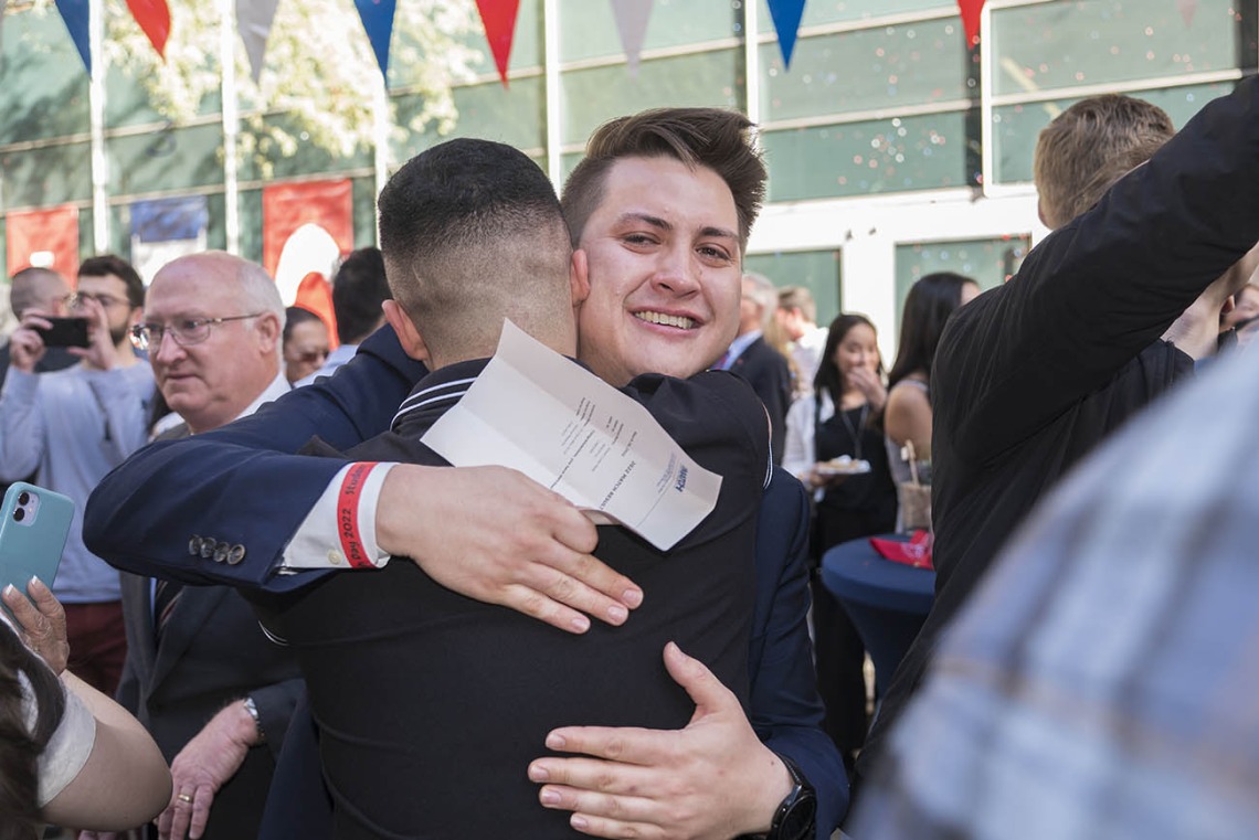 Med student Joseph Neely hugs a classmate celebrating his match during the UArizona College of Medicine – Phoenix Match Day 2022 event.