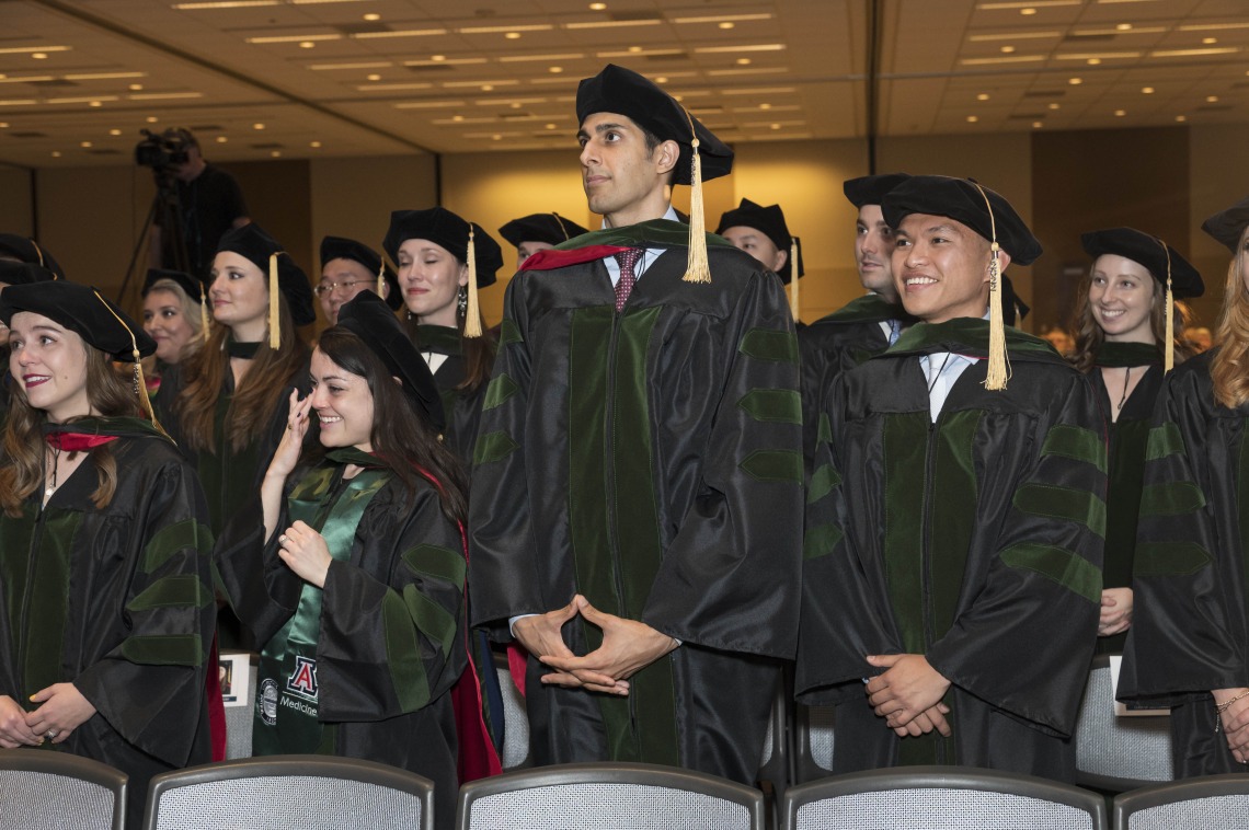 (Front row from left) Merrion Dawson MD, Nicole Deatherage, MD, Gurman Dhaliwal, MD, and Allen Doan, MD, stand for the conclusion of their College of Medicine – Phoenix class of 2022 commencement ceremony. 