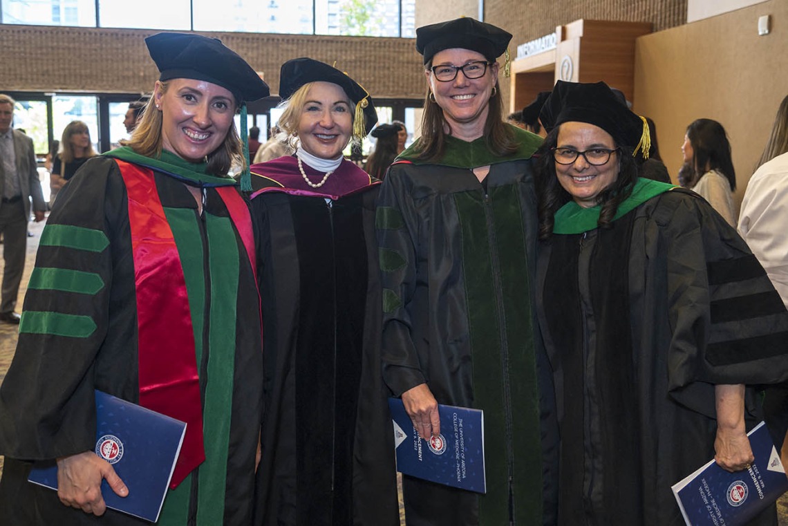 UArizona College of Medicine – Phoenix faculty pose for a photo after class of 2022 commencement ceremony. (From left) Natasha Keric, MD, director of surgery clerkship; Mandi Conway, MD, interim department chair, Ophthalmology; Susan Kaib, MD, FAAFP, career advisor, student affairs; and Marícela Moffitt, MD, MPH, FACP, director, doctoring curriculum.