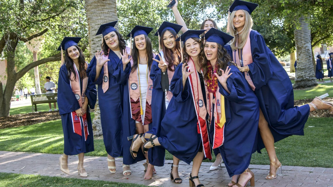 Public health undergraduate students are all smiles as they prepared to enter Centennial Hall for the 2022 Mel and Enid Zuckerman College of Public Health spring convocation.