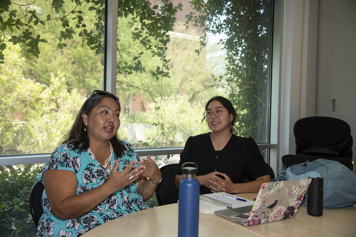Diné College program manager Kaitlyn Haskie (right) meets with Agnes Attakai, MPA, (left) of the College of Medicine – Tucson, for a mentoring session. Haskie studied health disparities among Native populations this summer.