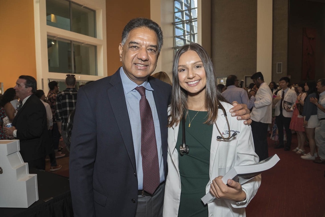 Nina Gautam poses for a photo with her father, Madhur Gautam, after the UArizona College of Medicine – Phoenix Class of 2026 white coat ceremony.