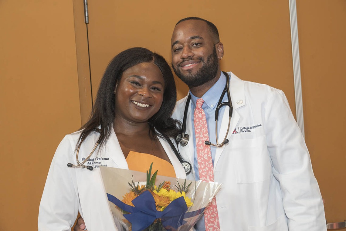 Class of 2026 students Blessing Ozioma Atanmo and Patrick Quarles pose after the UArizona College of Medicine – Phoenix Class of 2026 white coat ceremony.