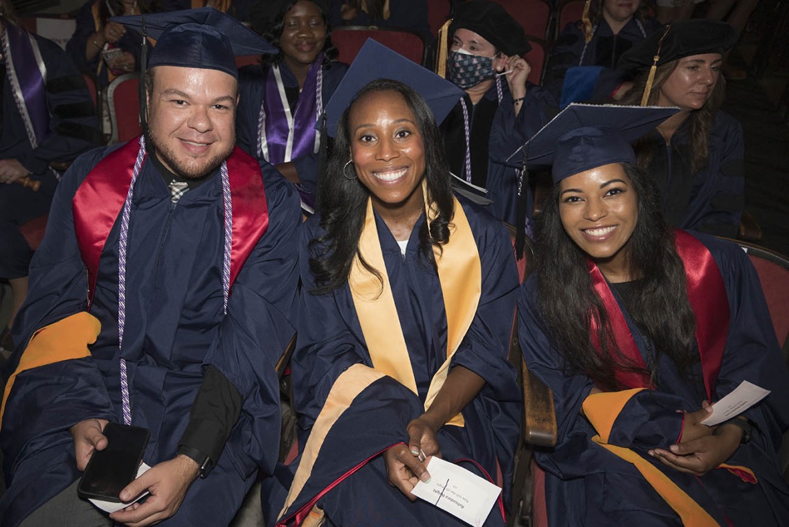 Felipe Jimenez, Rahsadara Wright and Leila Darbouze, all Master of Science in Nursing Entry to the Profession students, wait for the College of Nursing 2022 summer convocation to begin.