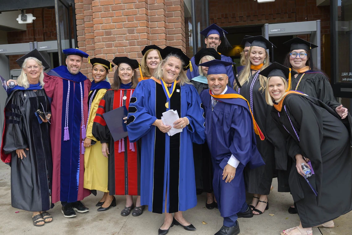 College of Nursing faculty from Tucson and Phoenix gather outside of Centennial Hall after the college’s 2022 summer convocation.