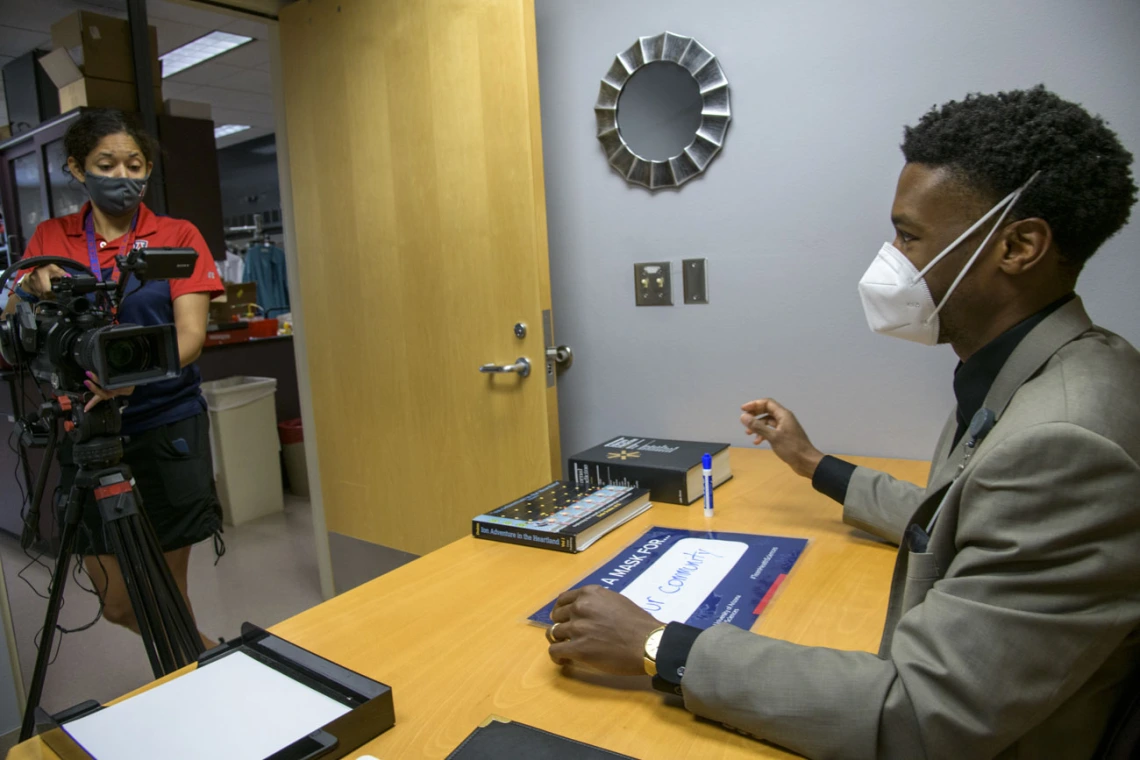 During video production for the “I Wear a Mask” campaign, Viola Watson, videographer for the UArizona Health Sciences Office of Communications, interviews Ike Chinyere,MD/PHD student, at the College of Medicine – Tucson, as he discusses the importance of wearing a mask.