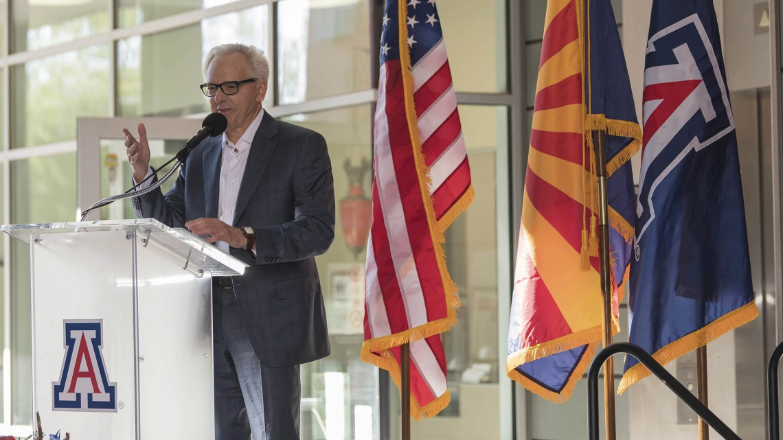 R. Ken Coit, a 1967 College of Pharmacy graduate, announces a gift of $50 million to the college during a ceremony that also renamed the college after Coit.