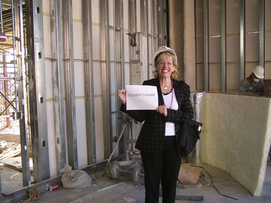 Chris Tisch stands in what will become the student lounge during a 2005 construction tour of Roy P. Drachman Hall.