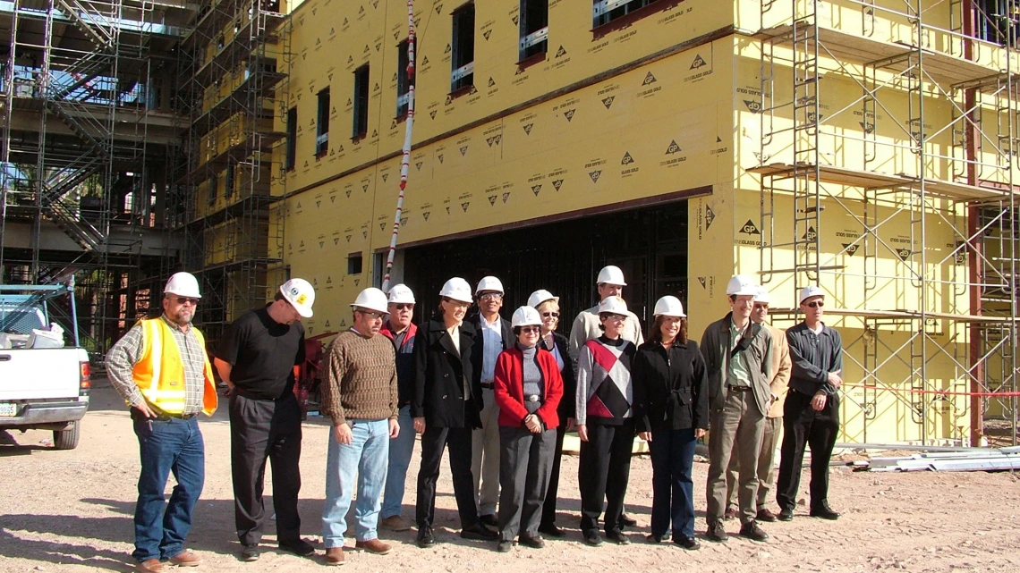 Faculty and staff take their first tour of Roy P. Drachman Hall in 2005, the future home of the Mel and Enid Zuckerman College of Public Health.