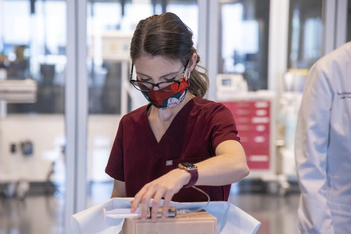 AGACNP student Chelsea Jo Cannon practices suturing during the intensive clinical skills training at ASTEC.   