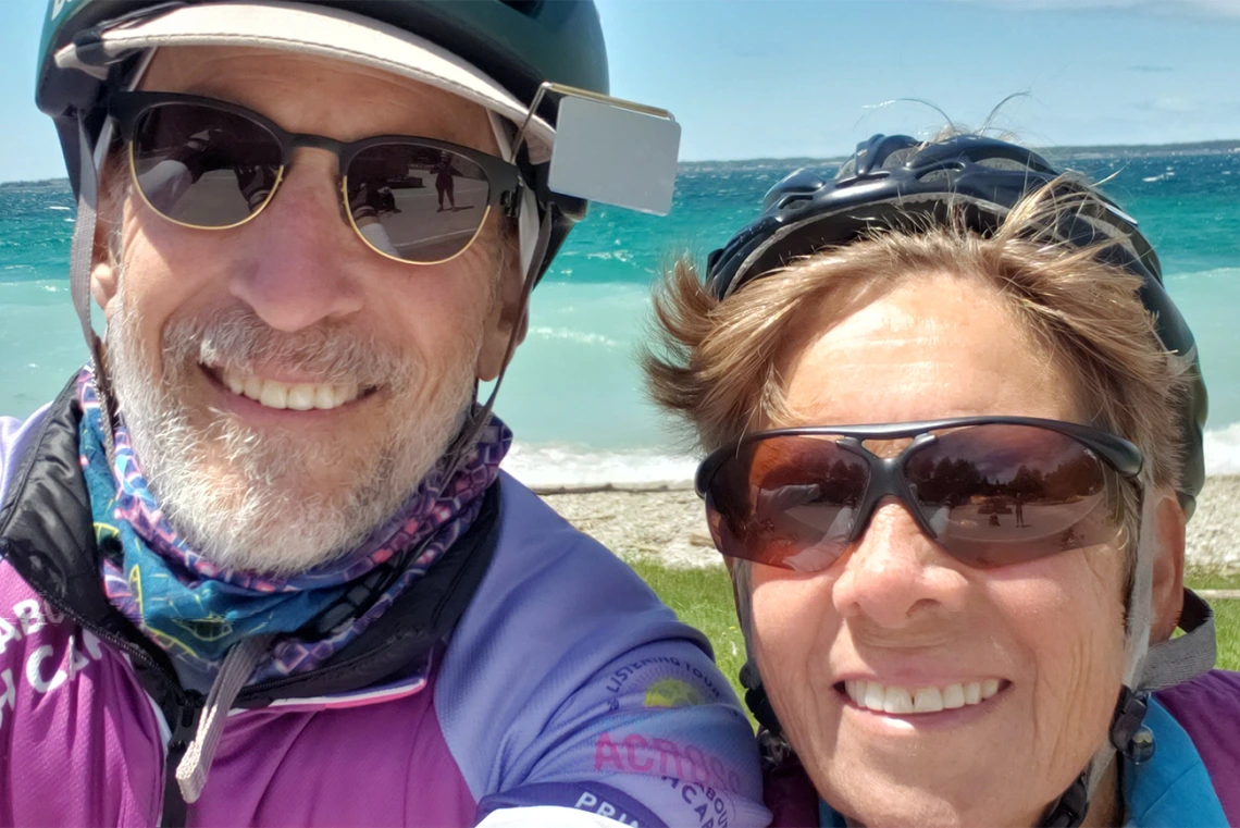 College of Medicine – Tucson professor Paul Gordon, MD, MPH, and his wife Eve Shapiro, professor emeritus, stop along the shore of Lake Michigan.