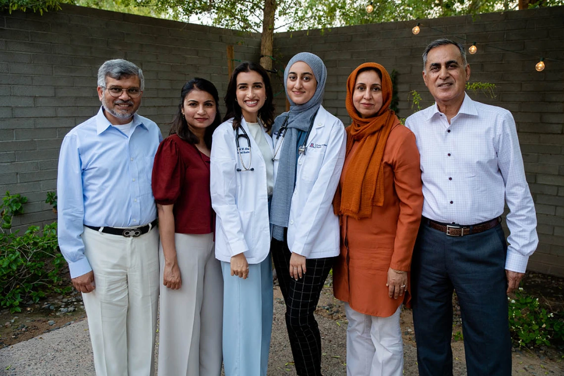 Amal Altaf and Noor Basharat with their families after the ceremony.