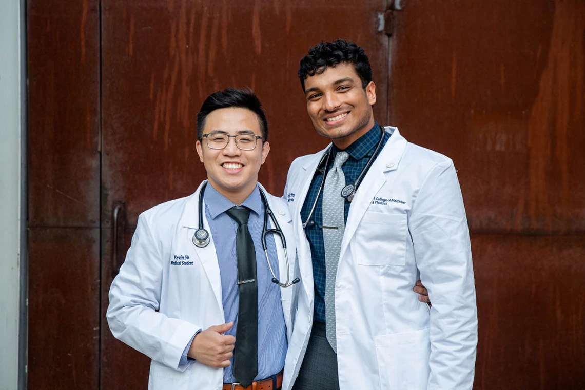 Kevin Vo and Ajay Bezawada celebrate after the ceremony.