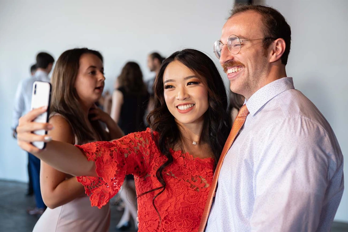 Maxine Yang and Sean McCauley mark the end of the white coat ceremony with a selfie. 