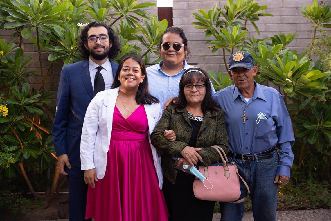 Elen Mendoza, front left, with her family after the white coat ceremony.