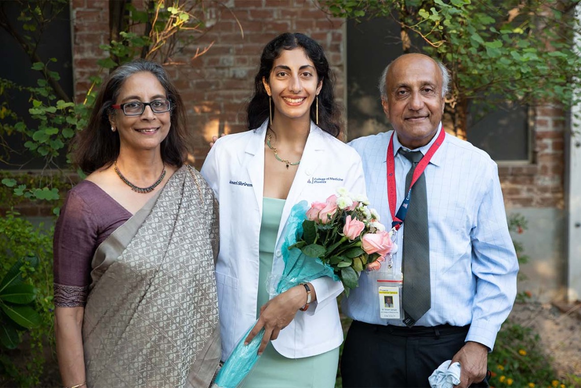Jahnavi Shriram, center, with her family after the white coat ceremony.