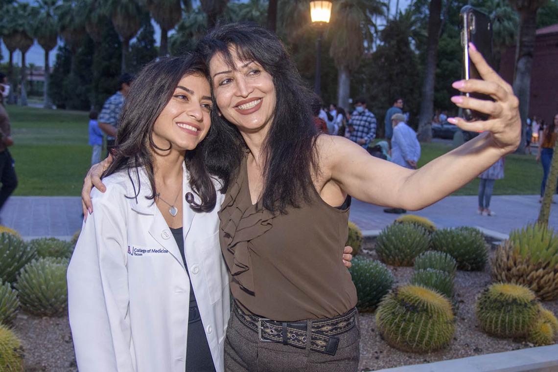 UArizona College of Medicine – Tucson student Pantea Sazegar and her mother Sohaila Samiei capture the moment with a selfie after the white coat ceremony.¬¬