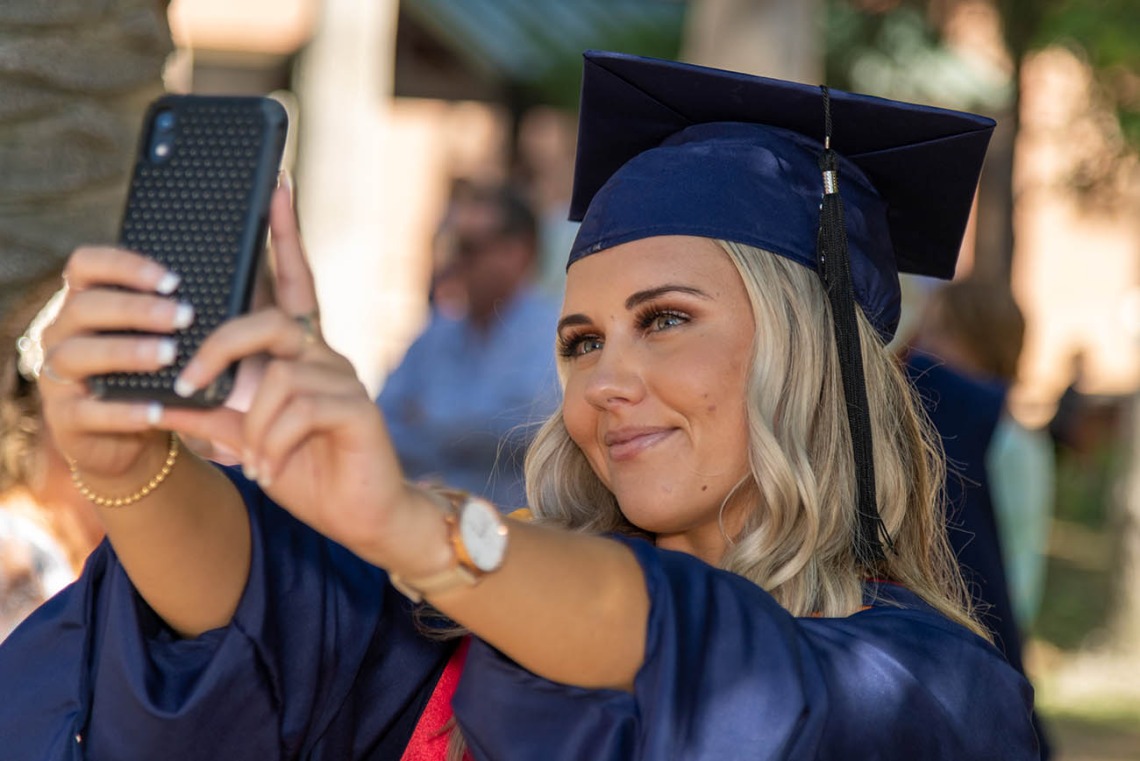 Caitlyn Bolier takes a selfie after her graduation ceremony from the College of Nursing.