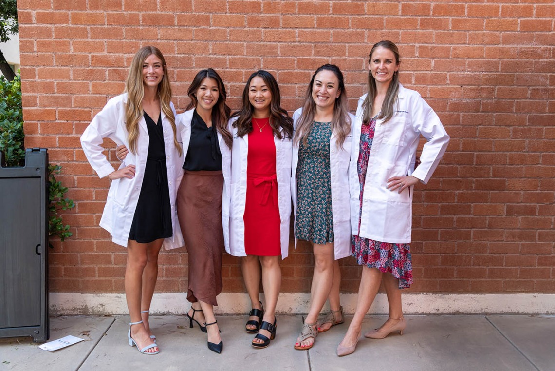 Doctor of Nursing Practice students (from left) Tyra Hepworth, Sherry Nguyen, Paige Nyland, Cynthia Hill and Stephanie Gasser gather for a photo after their white coat ceremony. 