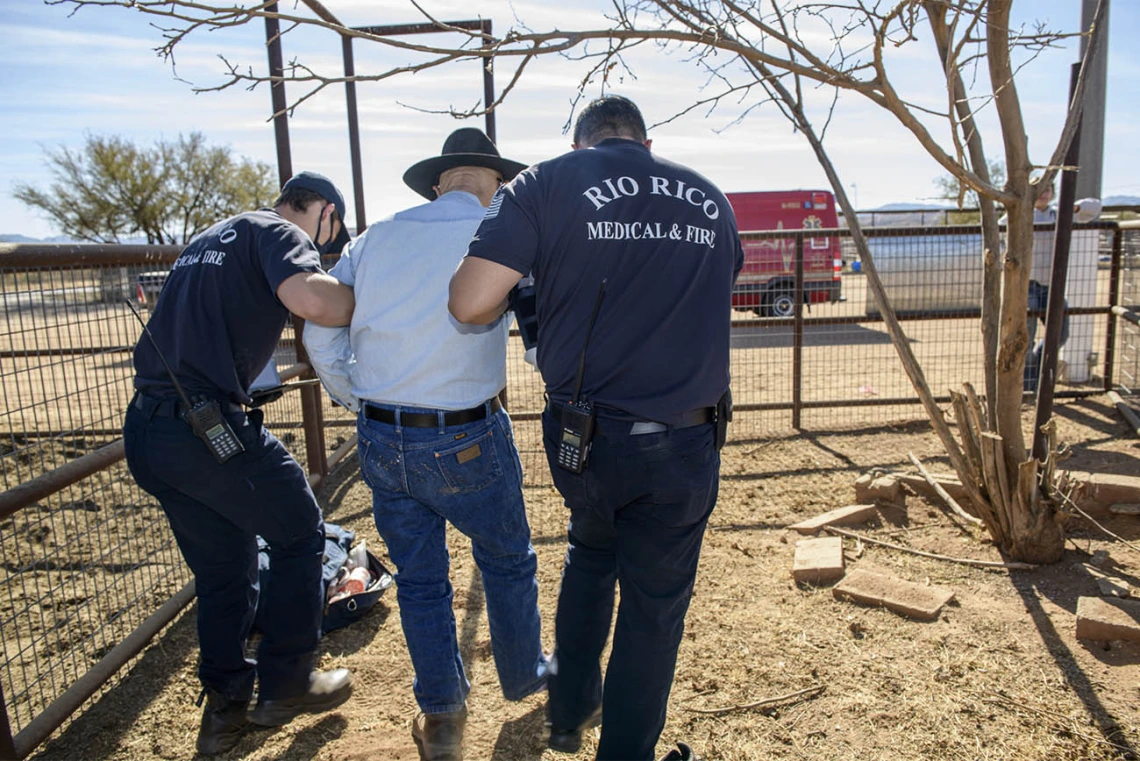 Weber and Saenz help Keller walk to the ambulance. (Note: This was a simulated accident scene for demonstration purposes.)