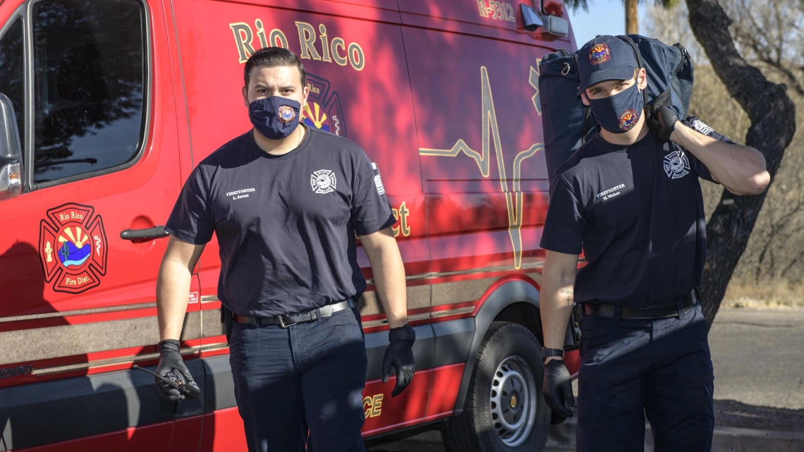 Rico Rio emergency medical technicians approach an accident scene. 