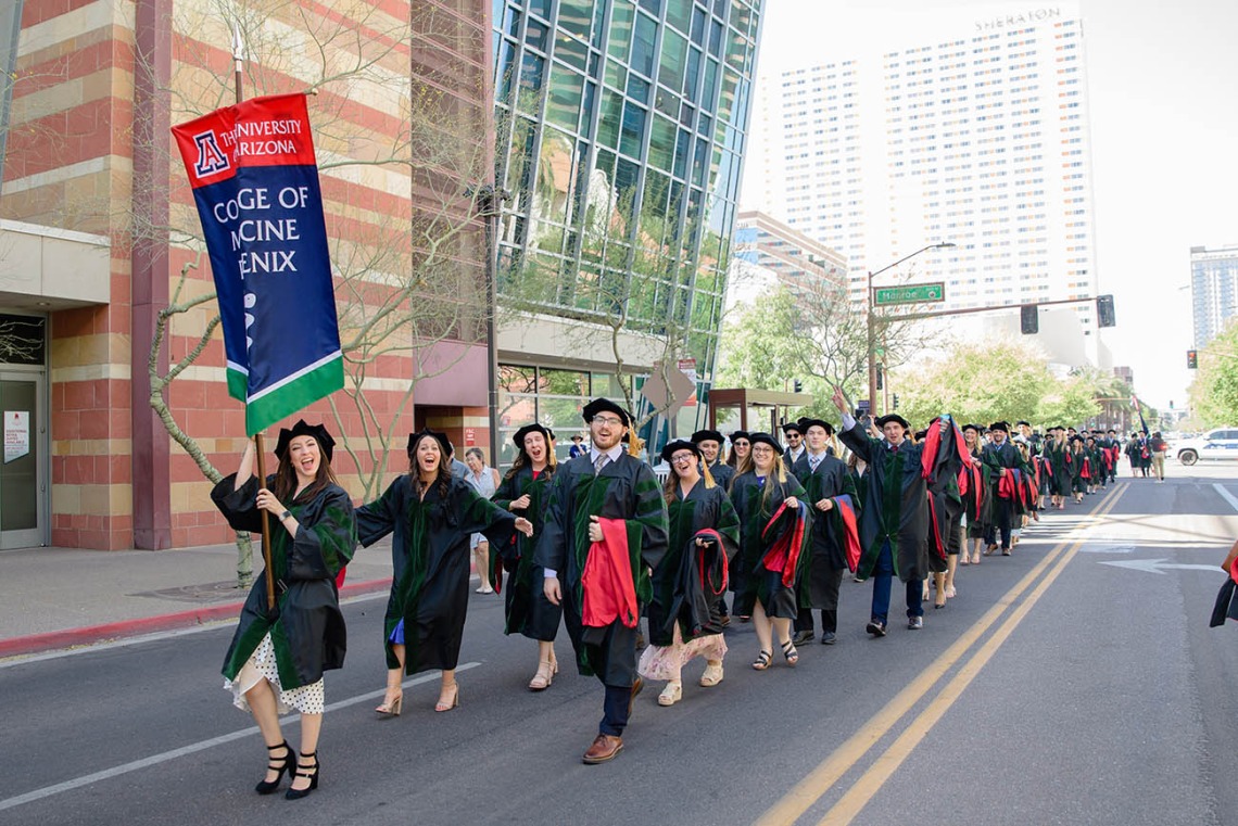 The College of Medicine – Phoenix class of 2022 parades through the streets of downtown Phoenix on their way to the Phoenix Convention Center for their commencement ceremony.