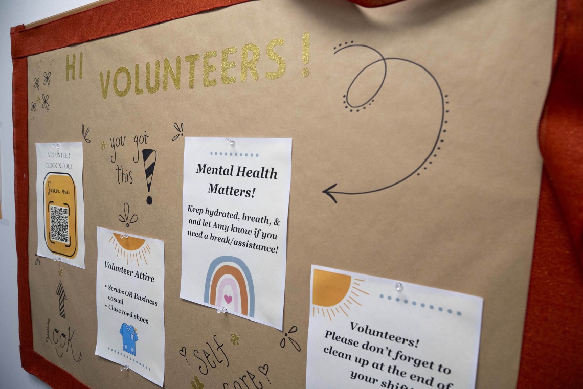 bulletin board welcomes volunteers with four flyers of useful information