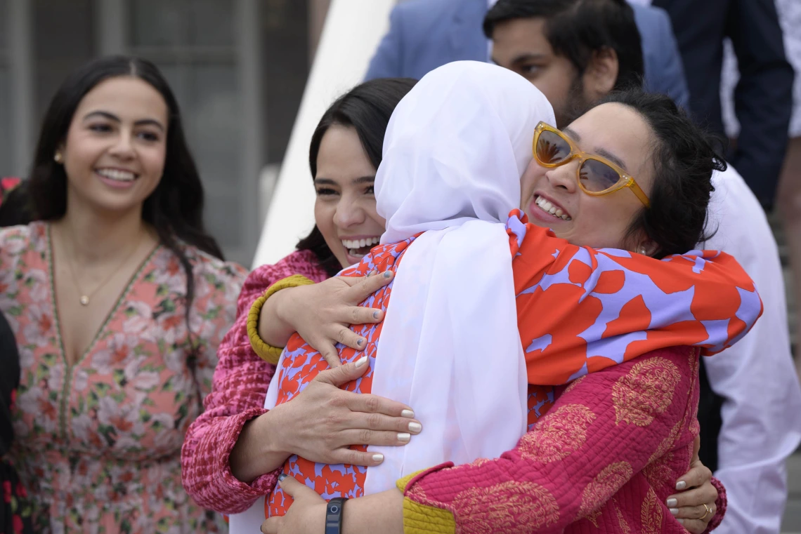 Three smiling women hug at the University of Arizona College of Medicine – Tucson Match Day celebration.