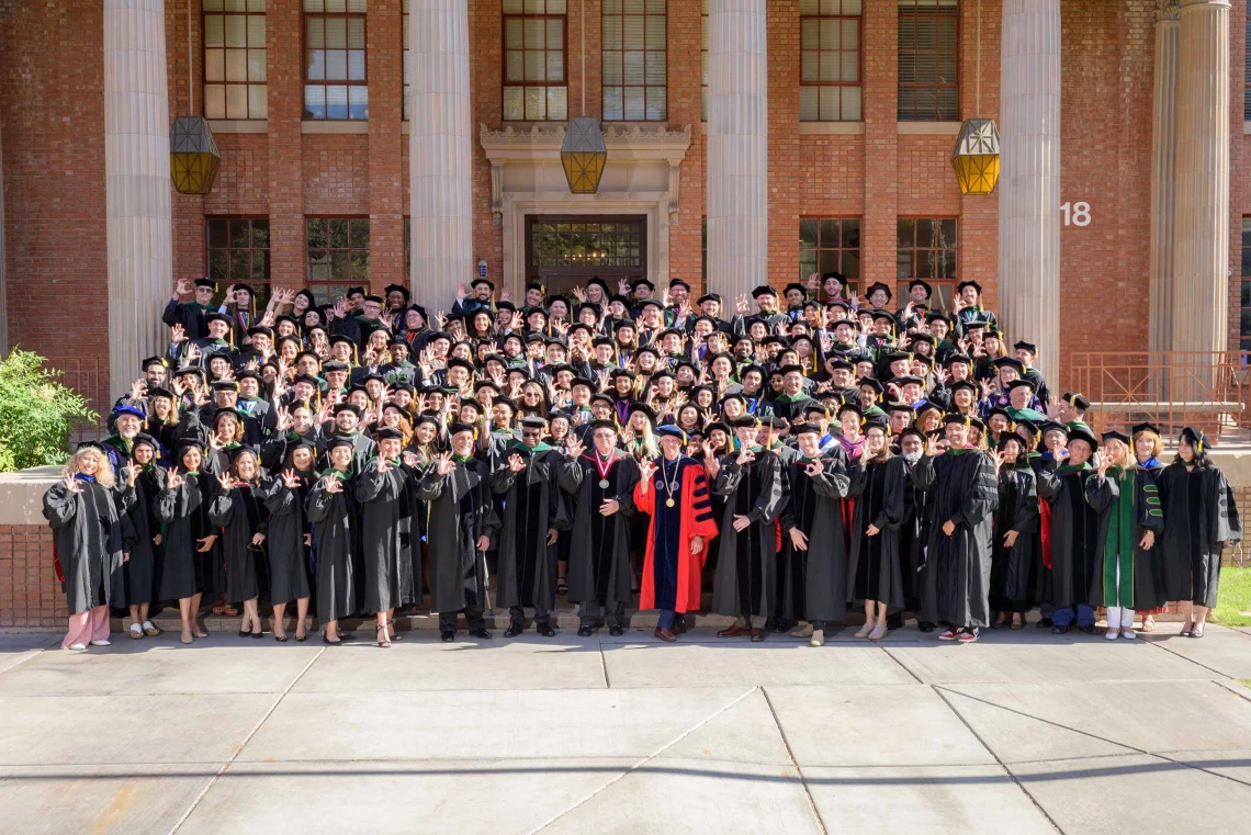 College of Medicine – Tucson Class of 2024 medical students on steps in front of Centennial Hall