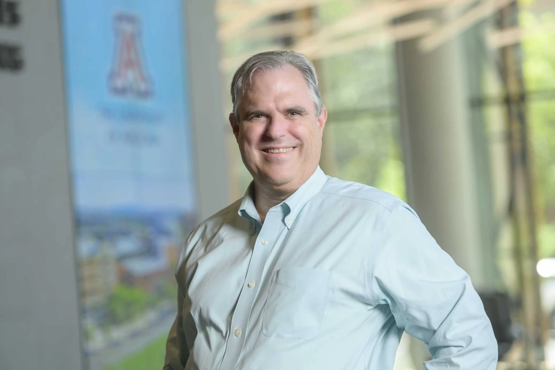 Outdoor portrait of Justin Starren, MD, PhD, on the grounds of the University of Arizona Health Sciences  