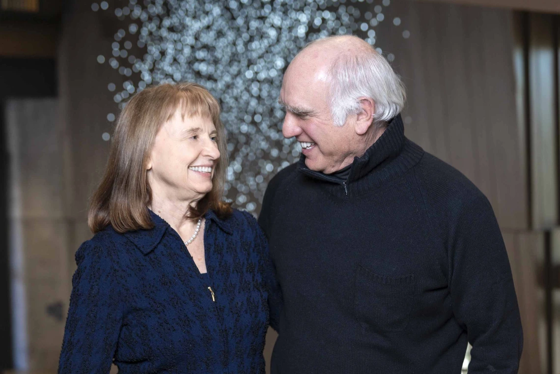 Karen Weihs, MD, and Richard D. Lane, MD, PhD, looking at each other and smiling.