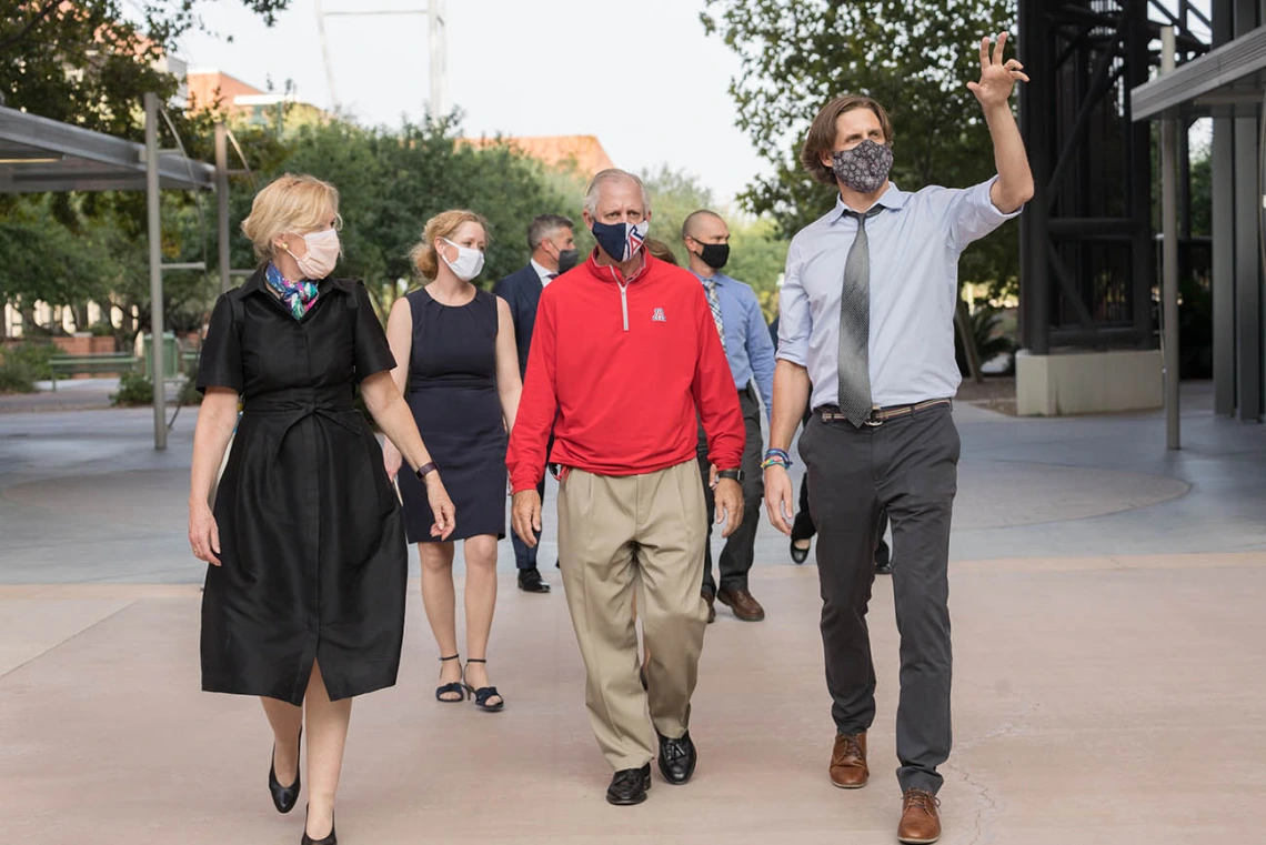 Ryan Sprissler, PhD (right), staff scientist and manager of the UArizona Genetics Core, leads Deborah Birx, MD, coordinator of the White House Coronavirus Task Force and university President Robert C. Robbins, MD on a tour of University of Arizona Health Sciences facilities on Friday, Sept. 18. Dr. Birx visited labs where researchers are conducting COVID-19 tests as part of a national tour of colleges and universities.