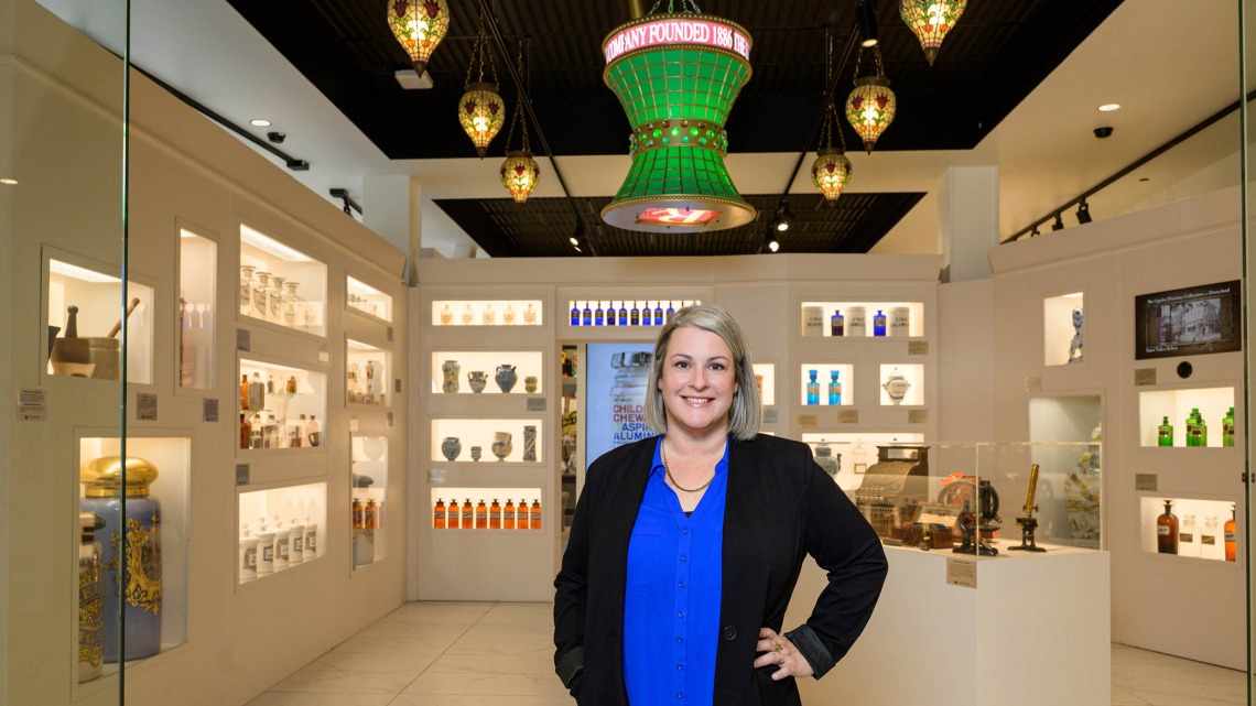 New Coit Museum of Pharmacy & Health Sciences director Alexis Peregoy stands in the newly renovated museum space. 