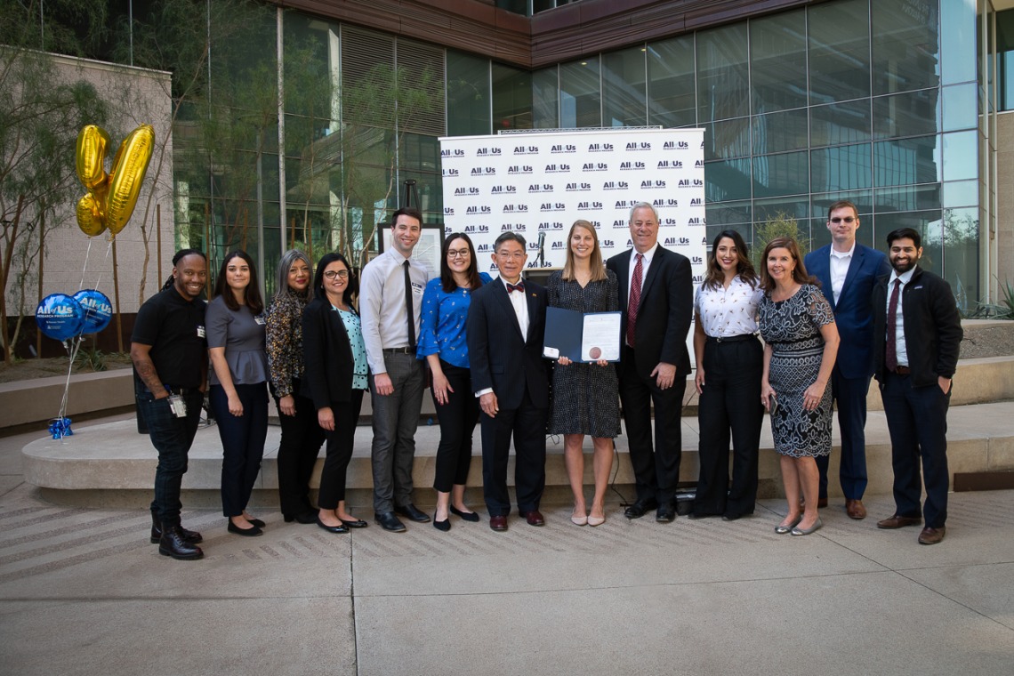 Members of the All of Us UArizona-Banner team pose with Barry Wong, JD, (center with bow tie) director of the Governor’s Office of Equal Opportunity, after he presented the governor’s proclamation declaring March “Arizonans in Health Research Month.” 