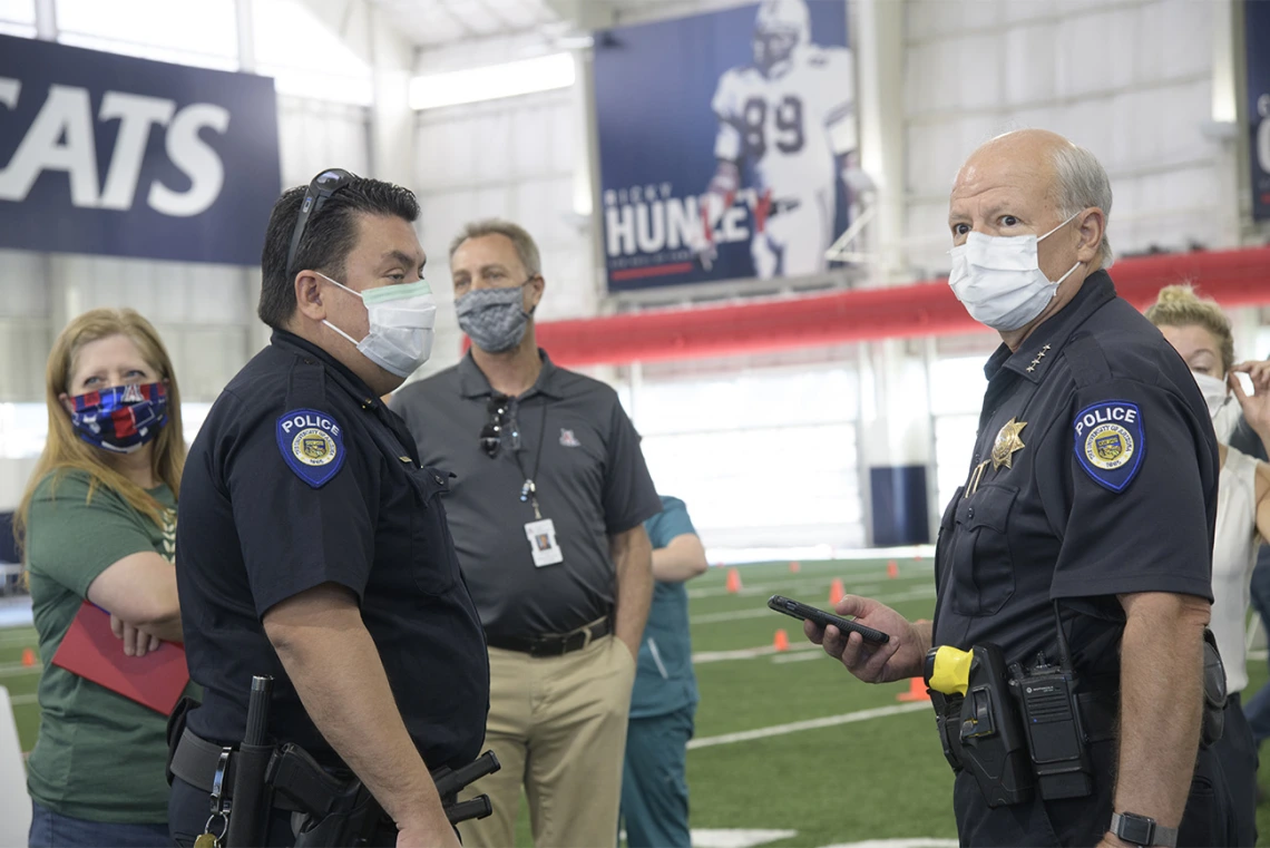 First responders and health care staff wait for their turn to be tested.