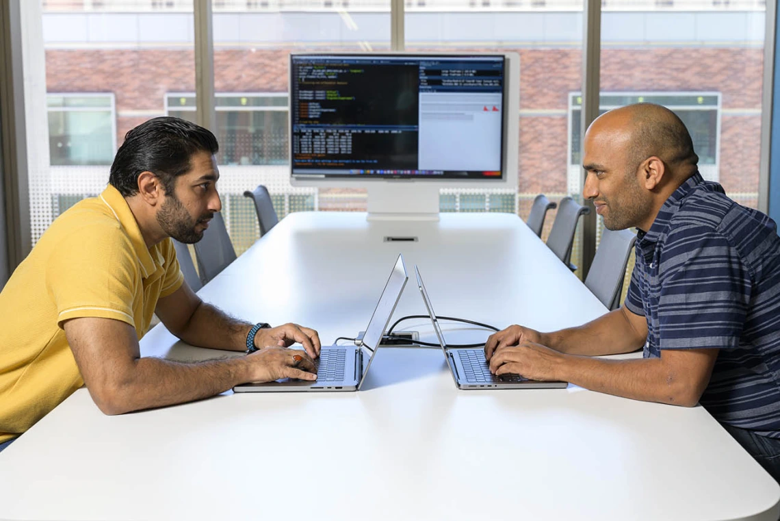 Syed Shujaat Ali Zaidi, PhD, (left) and Rudramani Pokhrel, PhD (right), are working with researchers to apply computational techniques to rapidly accelerate the pace of host-microbe research as part of Personalized Defense, a University of Arizona Health Sciences initiative.