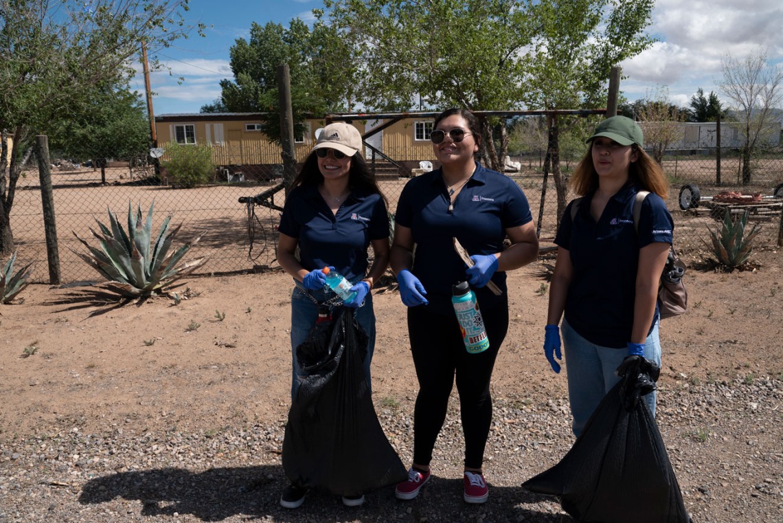 Martinez (center) and her fellow FRONTERA/BLAISER participants spent a hot Friday morning cleaning up streets in the community of Winchester Heights, about 95 miles east of Tucson.