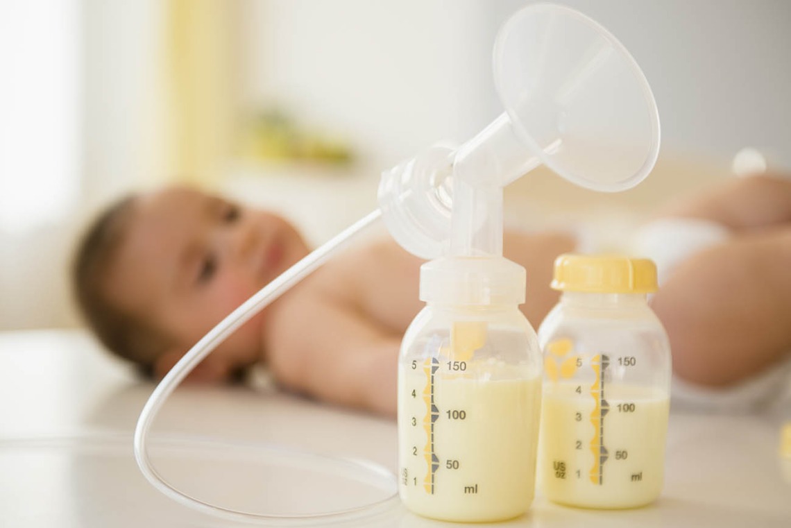 Breast pump next to baby