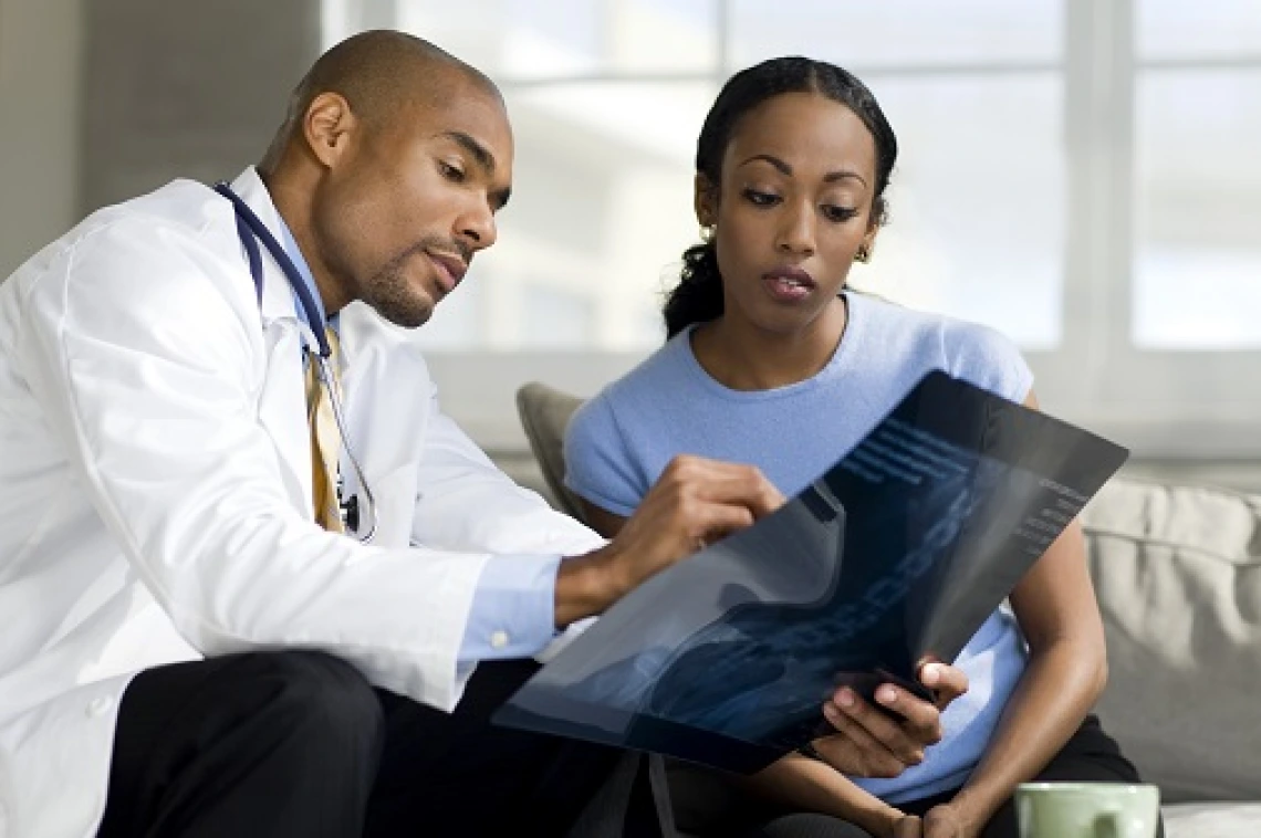 Doctor looking at x-ray with patient