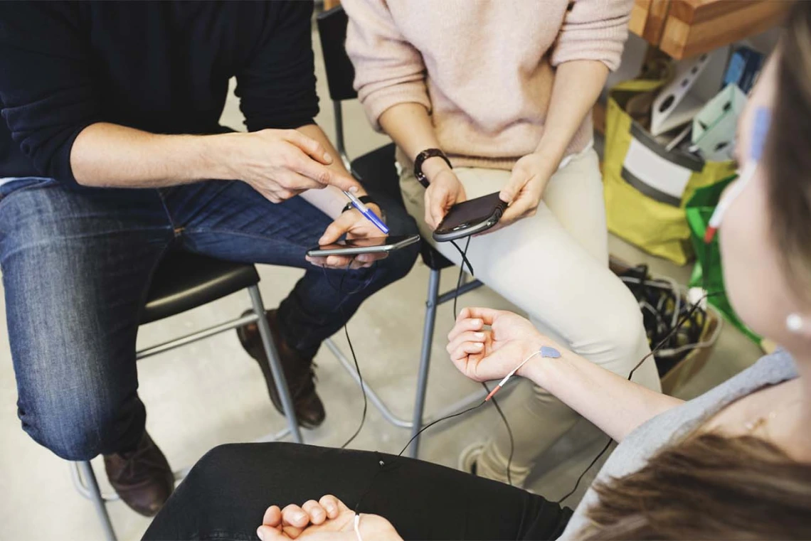 Group of people testing out a mobile application