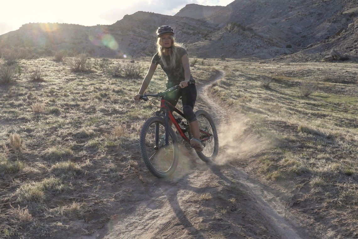 Mountain biker kicking up dust on an Arizona trail