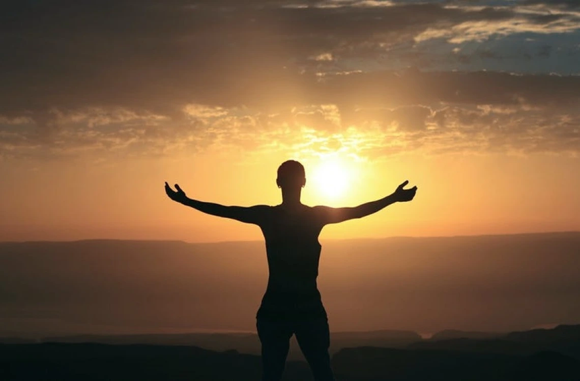Person watching sunset