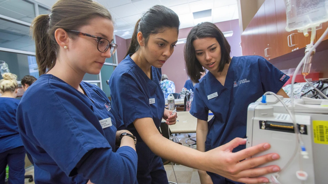 BSN students learn about medical devices in a classroom environment in 2018.