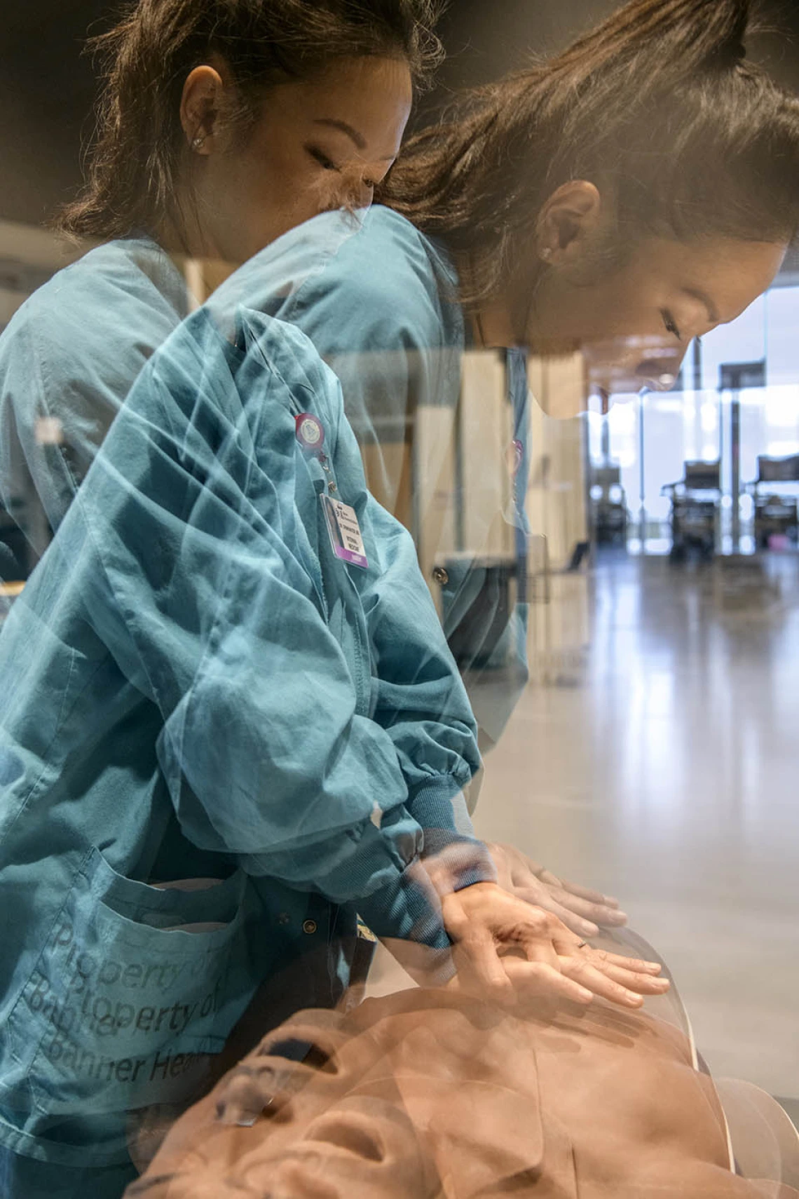 An internal medicine student uses a lifelike manikin to practice administering chest compressions.