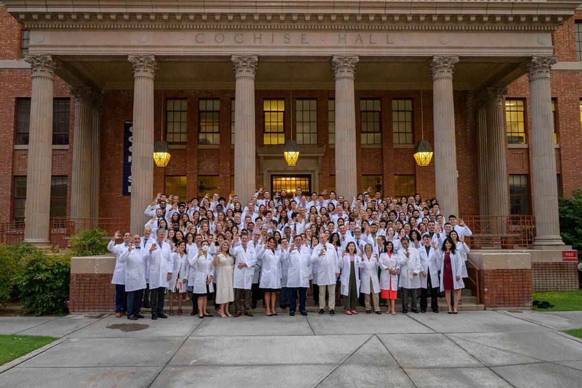 Members of the UArizona College of Medicine – Tucson Class of 2026 and faculty members gather for a photo after the white coat ceremony on July 29.