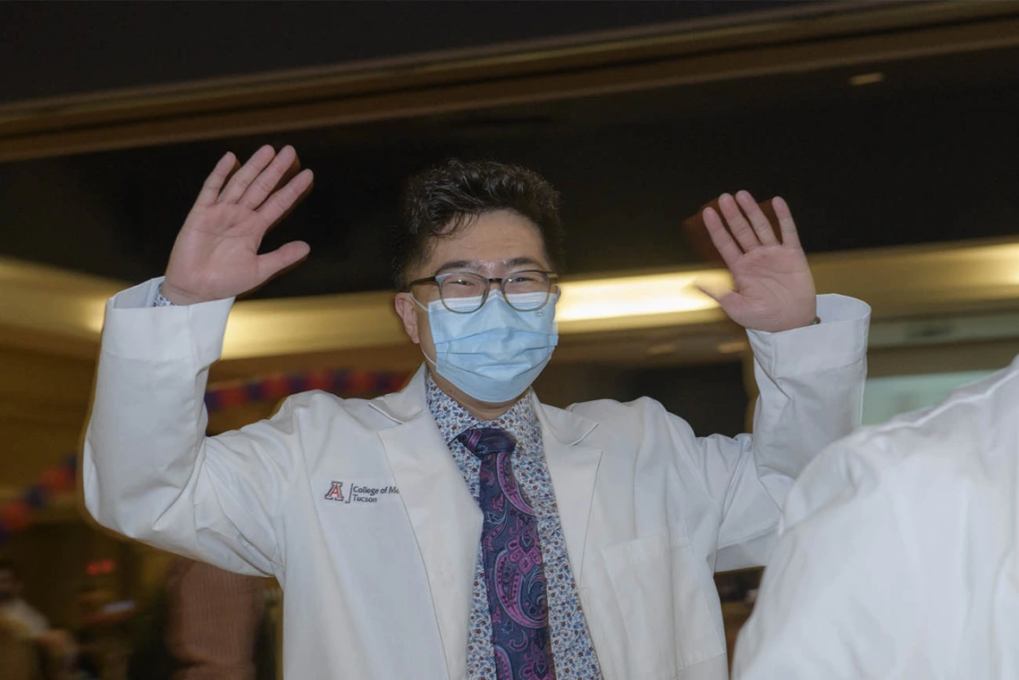 Lawrence Sun gives a “woot, woot” after the UArizona College of Medicine – Tucson’s class of 2024 white coat ceremony.